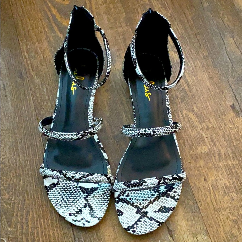 Snake print sandals with a 1/2 inch heel